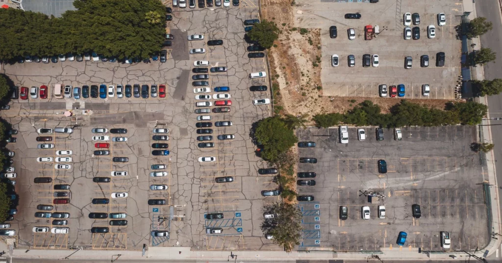 parking-space-occupancy-detection-outdoor-featured Aerial view of an outdoor parking lot with occupied and empty spaces
